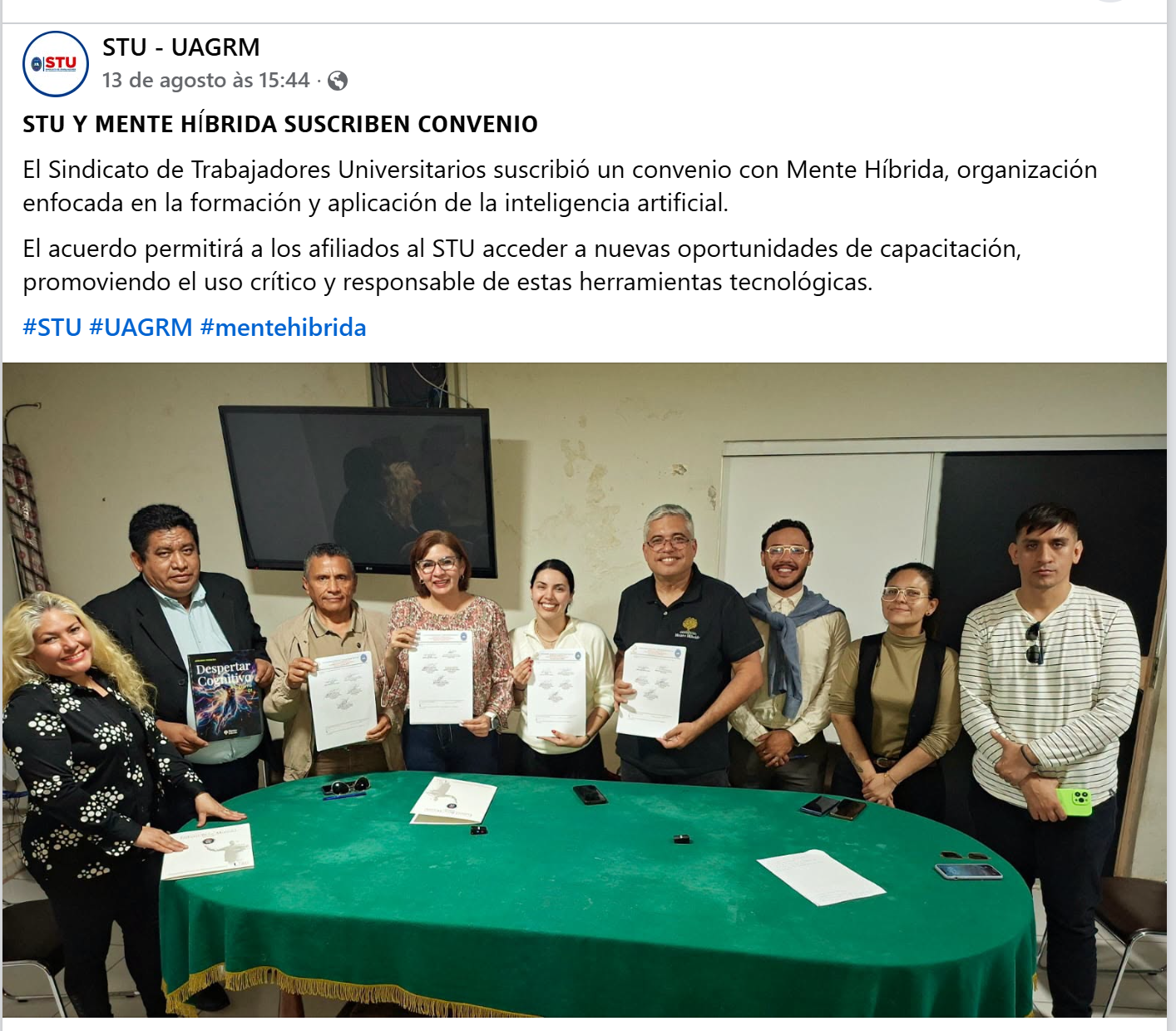 Anúncio do STU–UAGRM com a foto do grupo e os documentos do convênio com Mente Híbrida